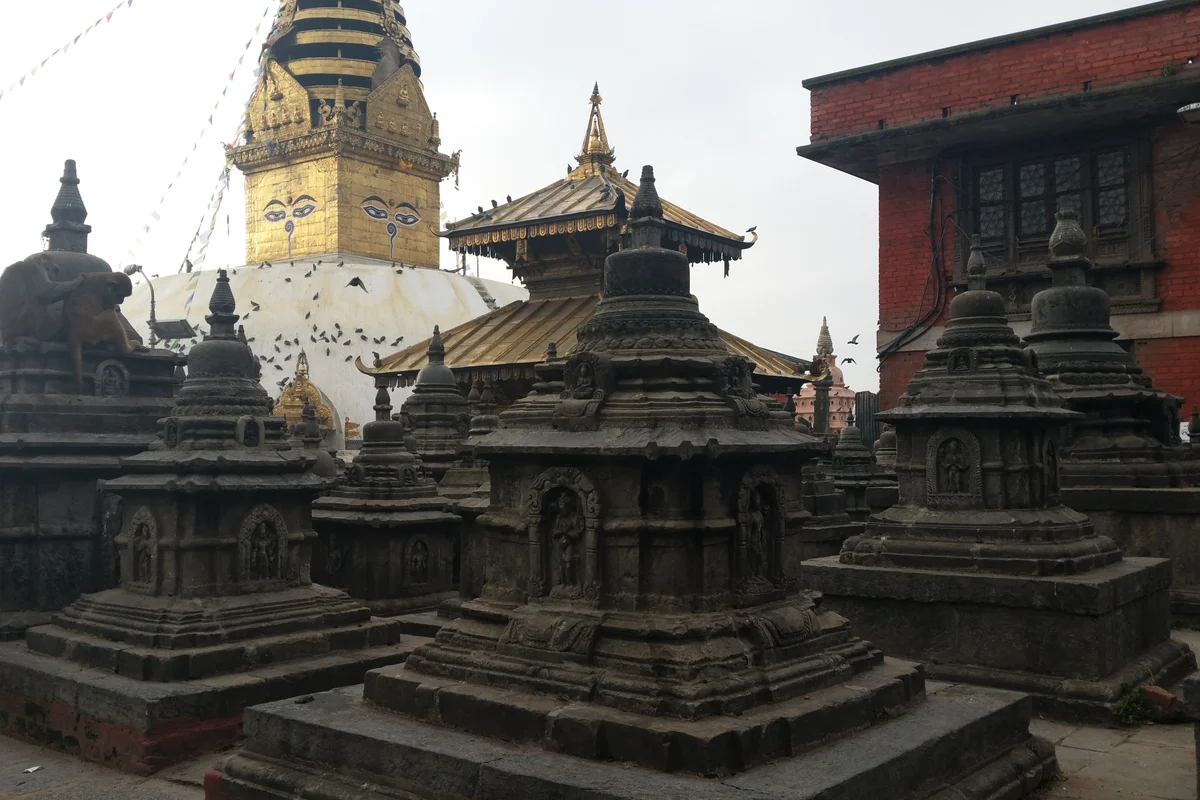Swayambhunath stupa with prayer flags on the hill above the valley
