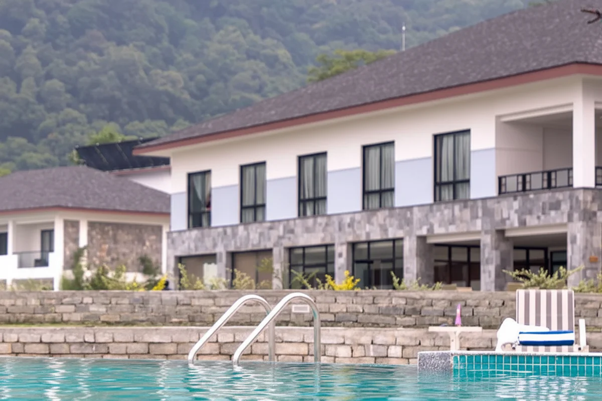 A resort swimming pool against the foothills